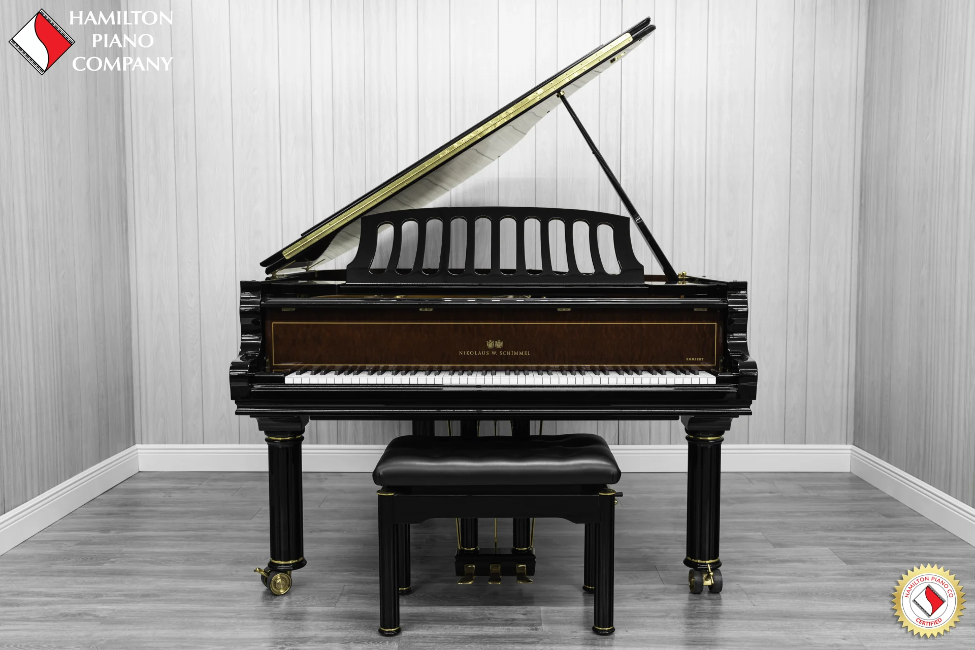 a beautiful Schimmel Meisterstücke NWS Edition Grand Piano, finished in polished ebony with mahogany accents and brass hardware.