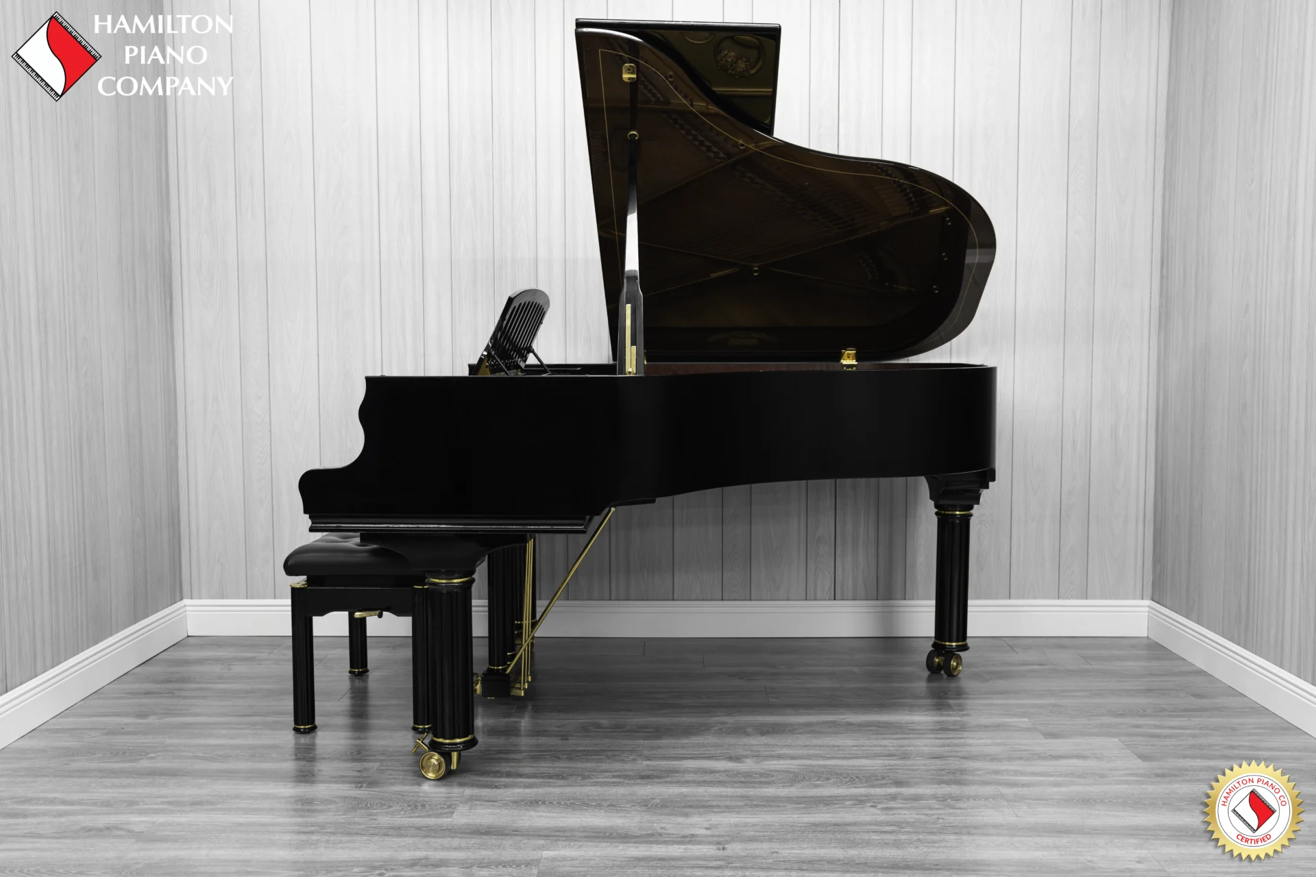a beautiful Schimmel Meisterstücke NWS Edition Grand Piano, finished in polished ebony with mahogany accents and brass hardware.