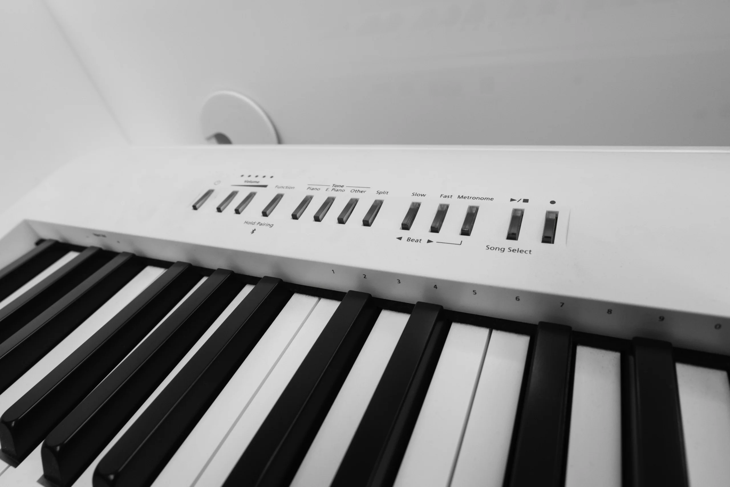 Roland FP-30X digital piano in a white and transparent acrylic shell with full-size weighted keys and modern design