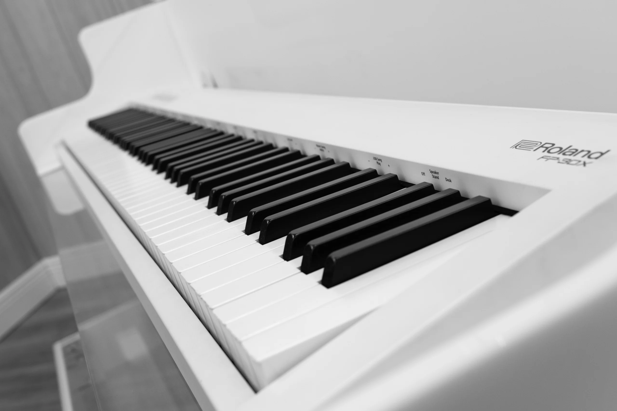 Roland FP-30X digital piano in a white and transparent acrylic shell with full-size weighted keys and modern design
