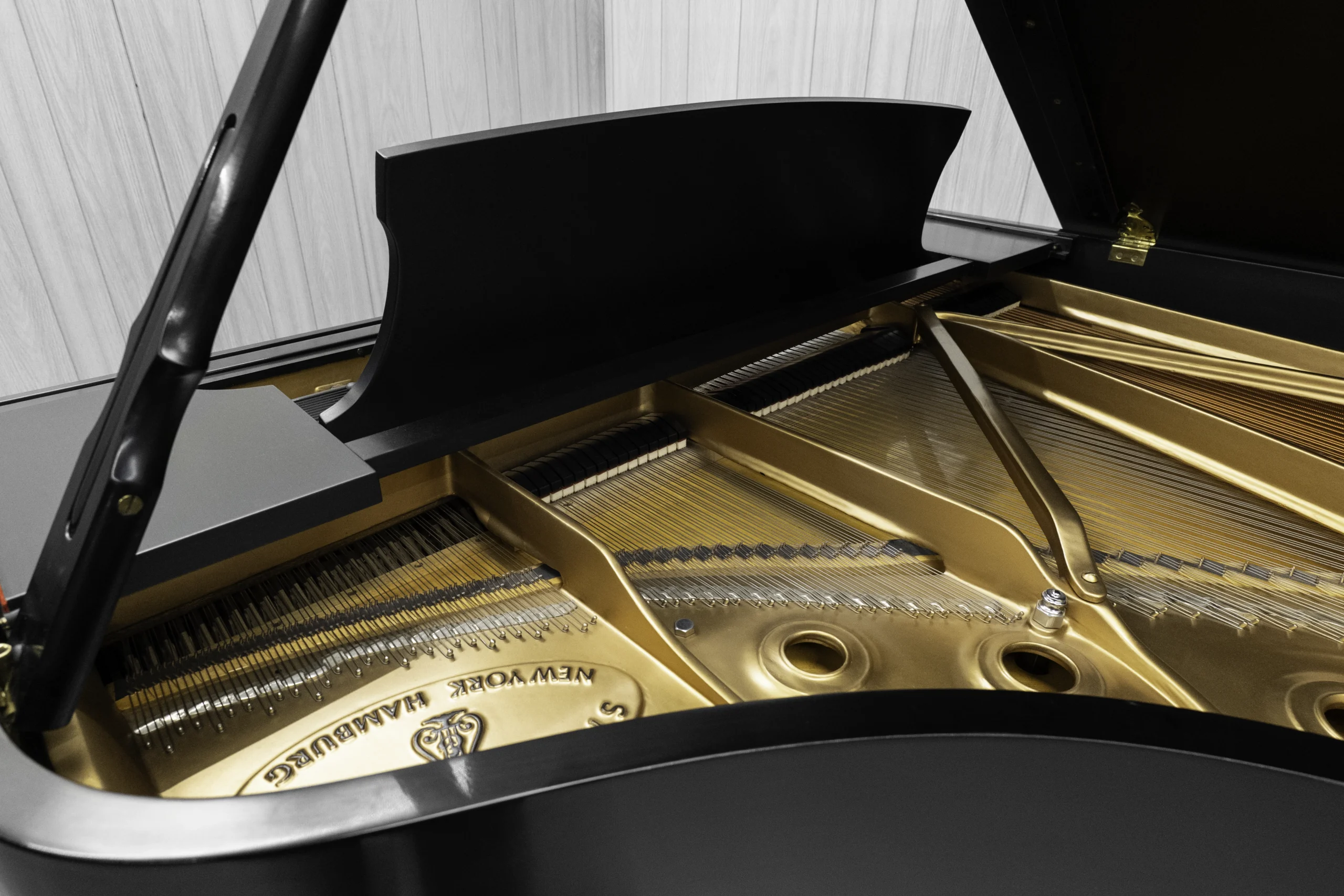 1984 Steinway B Grand Piano in satin ebony finish. This image shows the interior of the piano including the harp and strings.