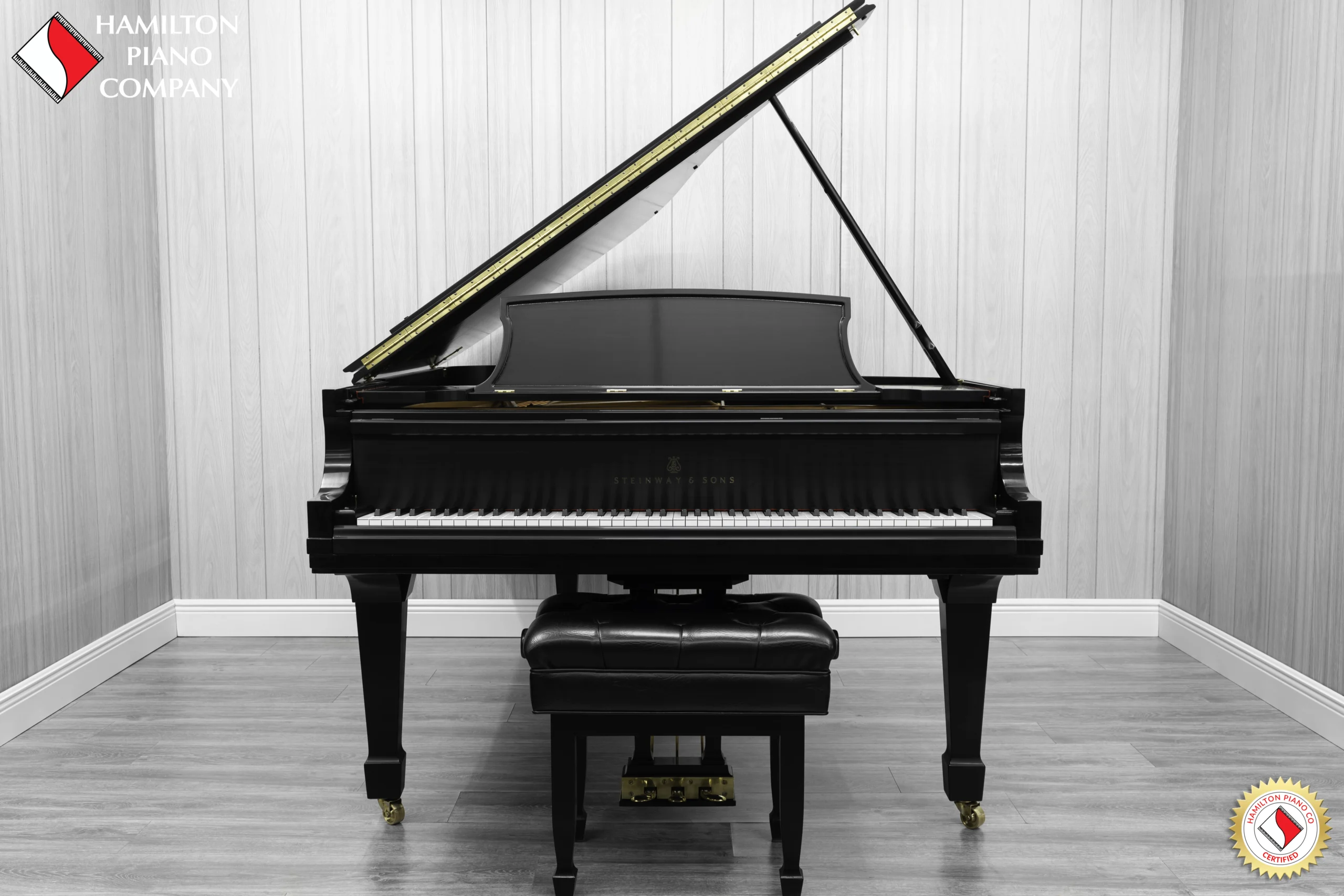 1984 Steinway B Grand Piano in satin ebony finish with bench.