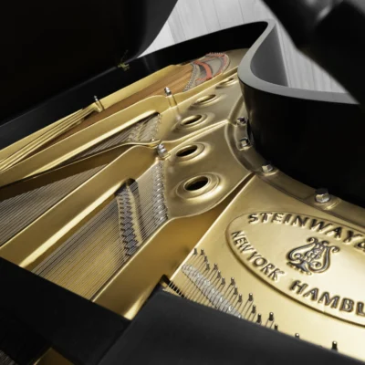 1984 Steinway B Grand Piano in satin ebony finish. This image shows the interior of the piano including the harp and strings.