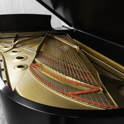 1984 Steinway B Grand Piano in satin ebony finish. This image shows the interior of the piano including the harp and strings.