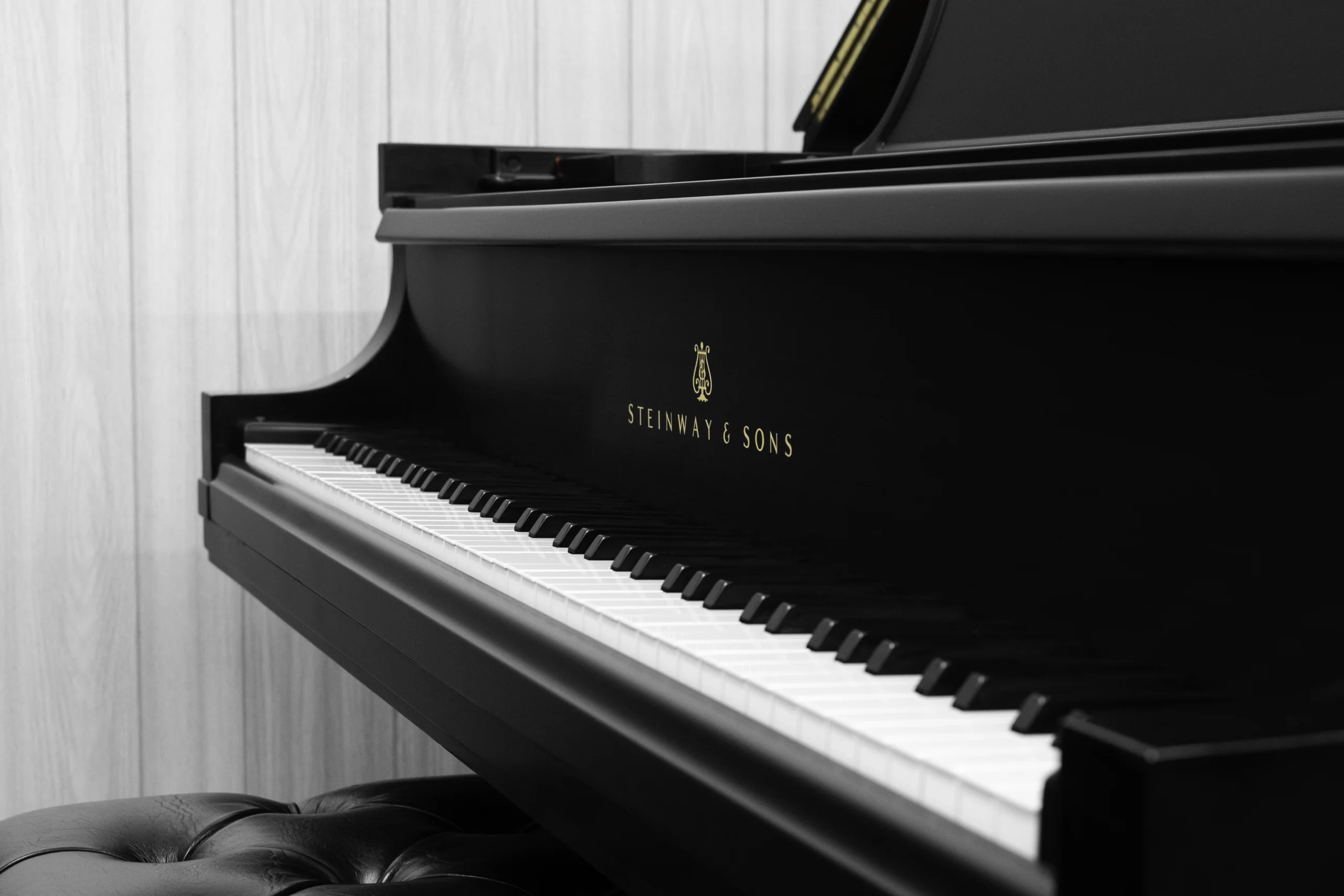 1984 Steinway B Grand Piano in satin ebony finish. This image shows off the keys and steinway logo on the fallboard