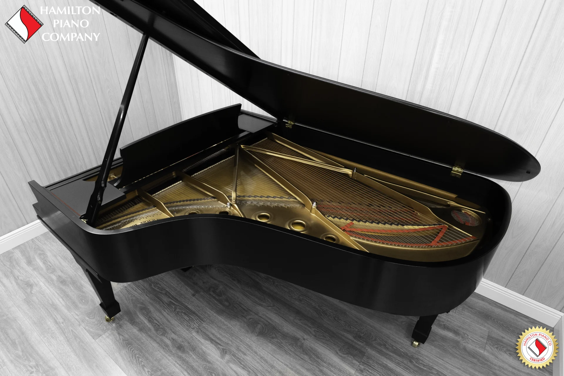 1984 Steinway B Grand Piano in satin ebony finish. This image shows the interior of the piano including the harp and strings.