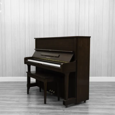 A Yamaha U1AR Vertical Piano in a satin walnut finish.