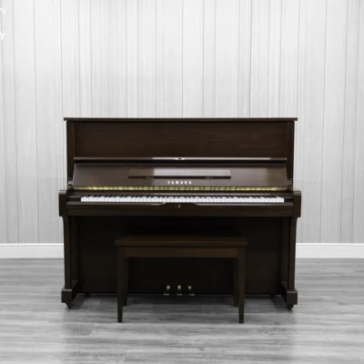 A Yamaha U1AR Vertical Piano in a satin walnut finish.