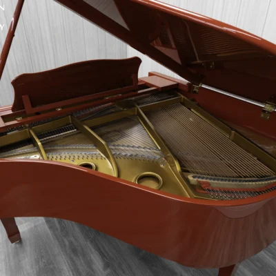 A Young Chang G-157 baby grand piano in a high polish red finish with matching bench. This image shows off the interior of the piano, including the harp and strings.