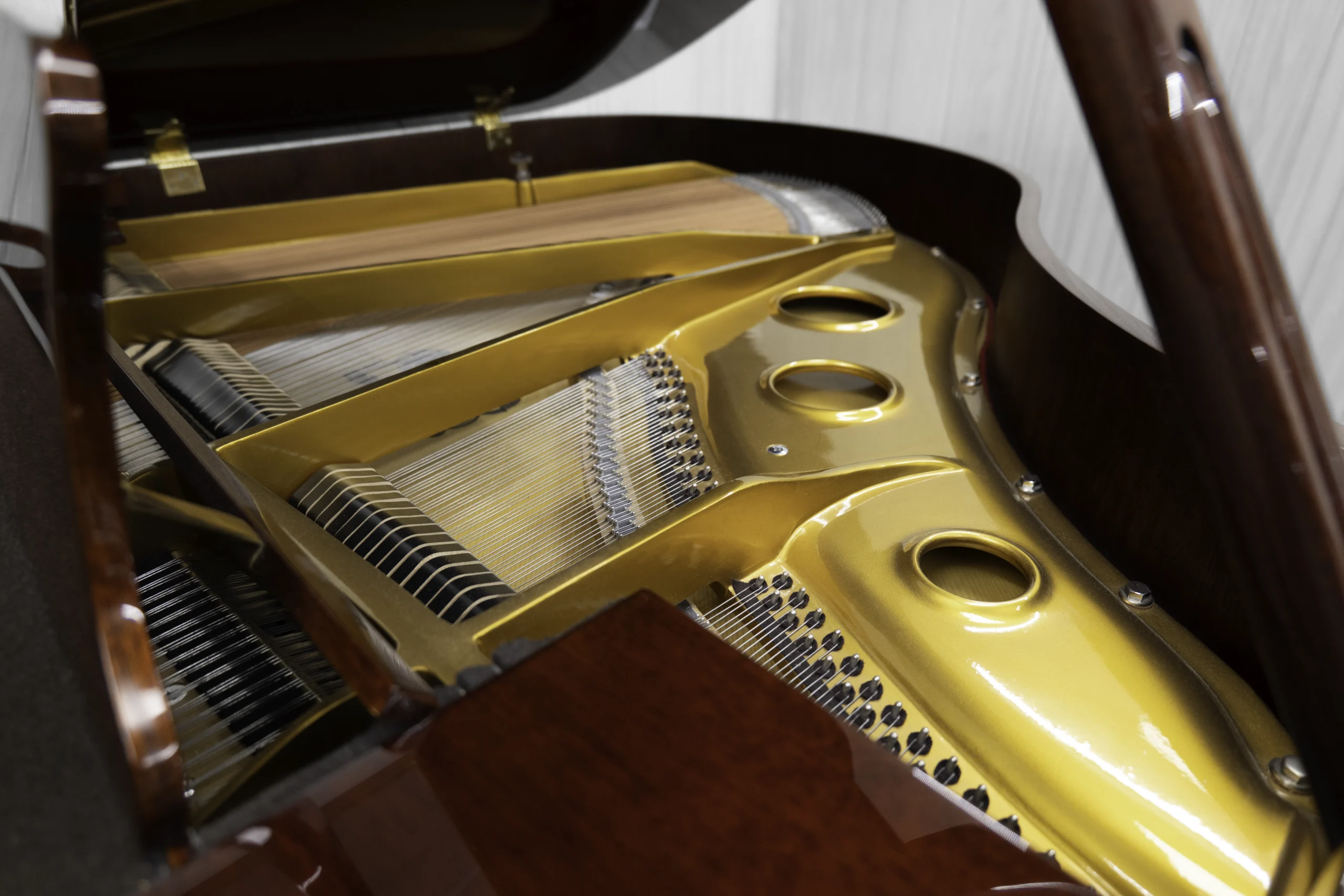 Haileer baby grand piano in high polish mahogany.