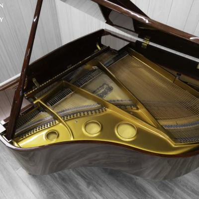 Haileer baby grand piano in high polish mahogany.