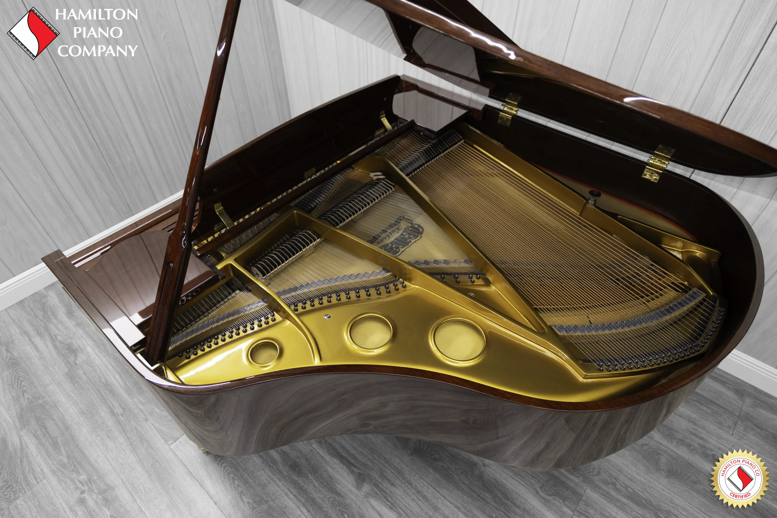 Haileer baby grand piano in high polish mahogany.