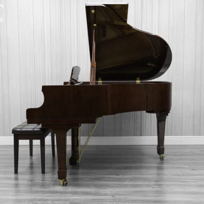 Haileer baby grand piano in high polish mahogany.