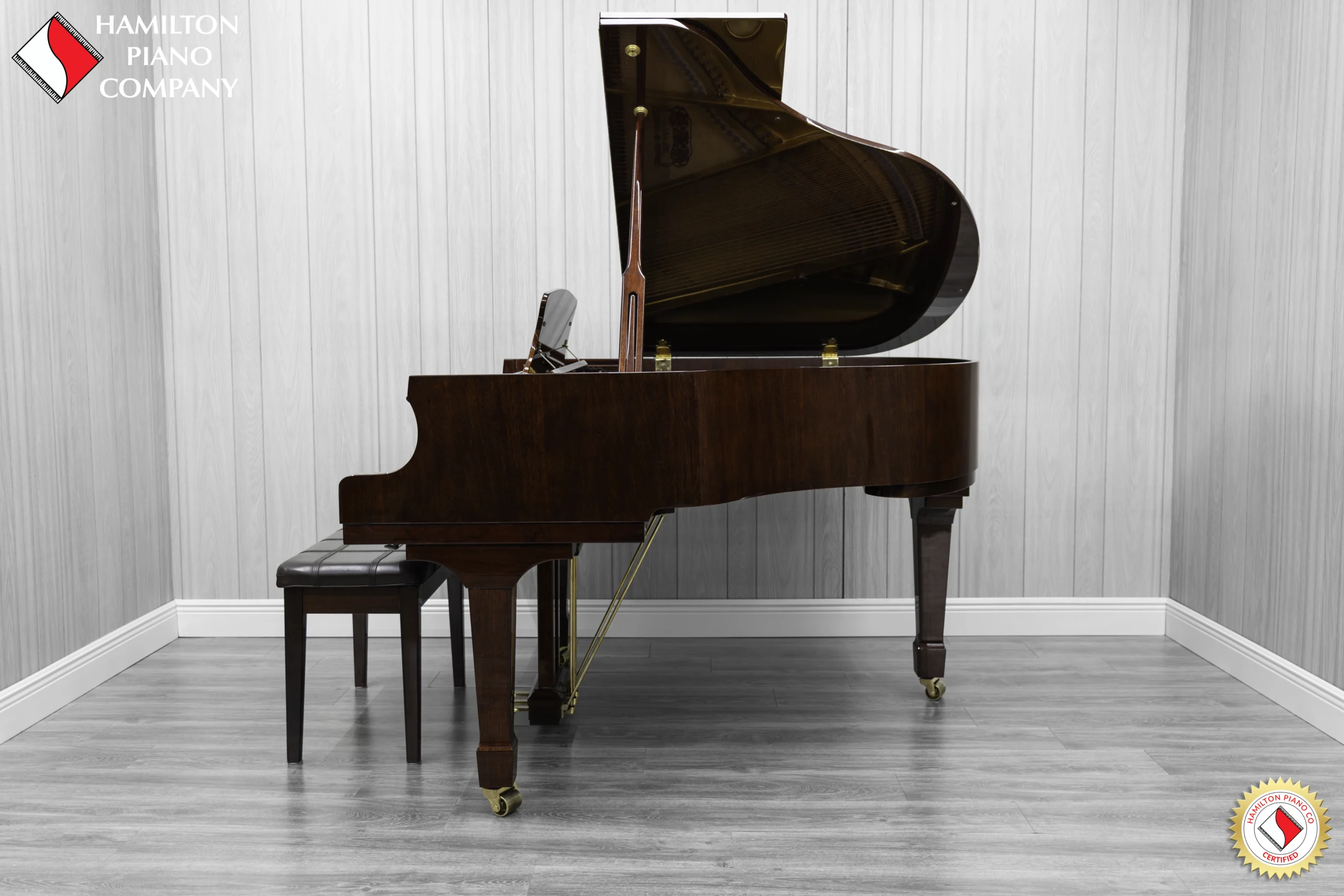 Haileer baby grand piano in high polish mahogany.