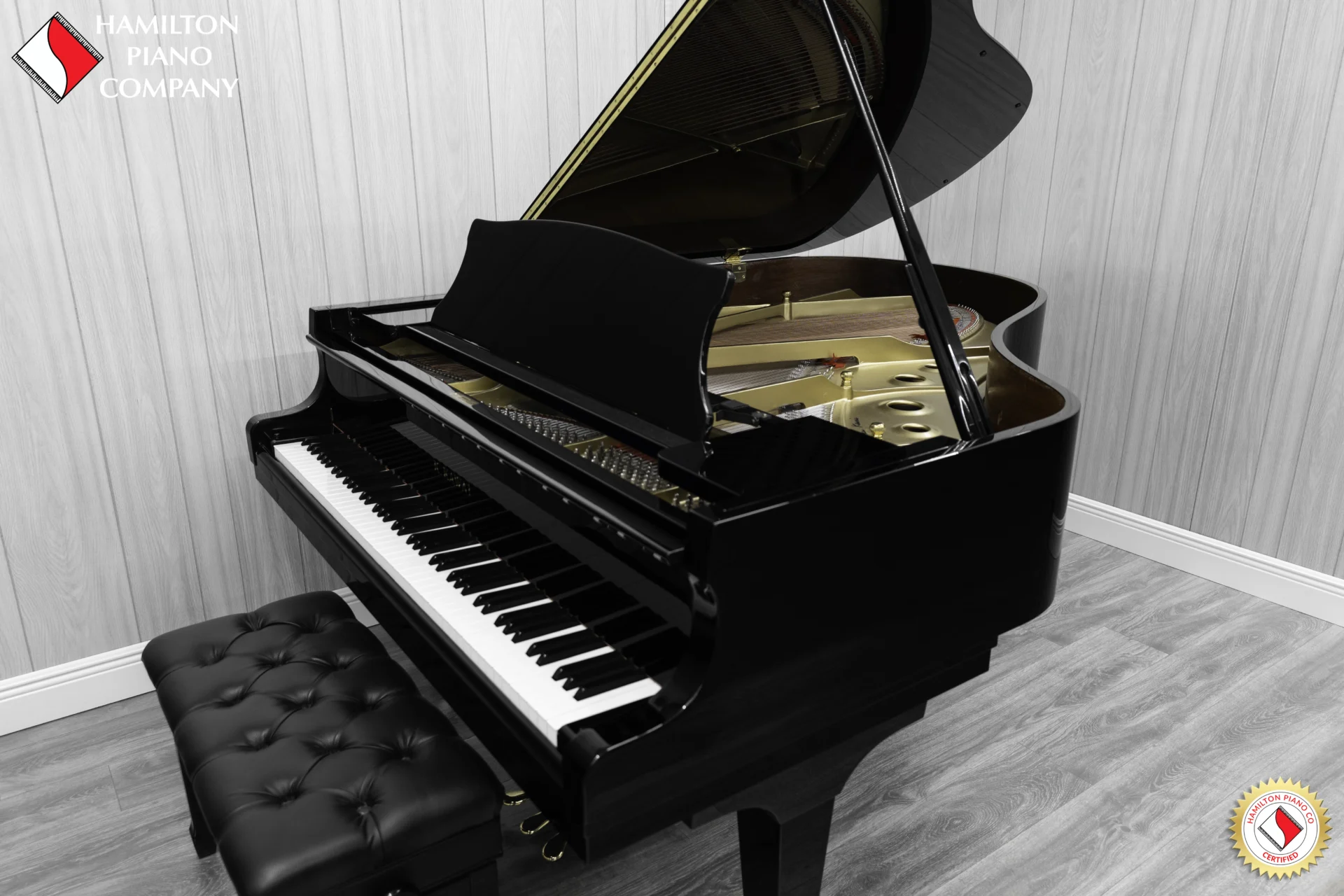 A Kawai RX-3 grand piano in a high-polish ebony finish.