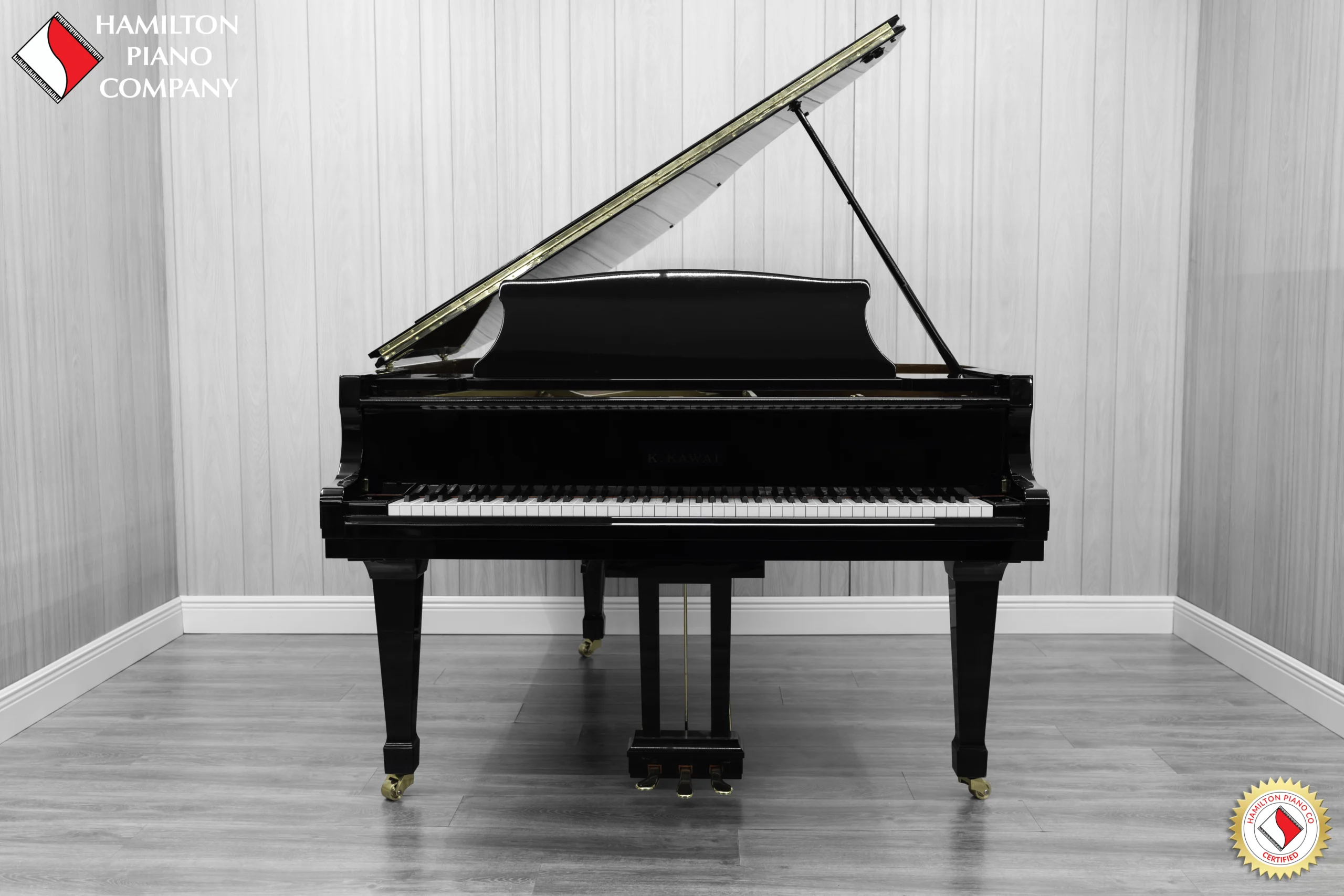 A Kawai RX-3 grand piano in a high-polish ebony finish.