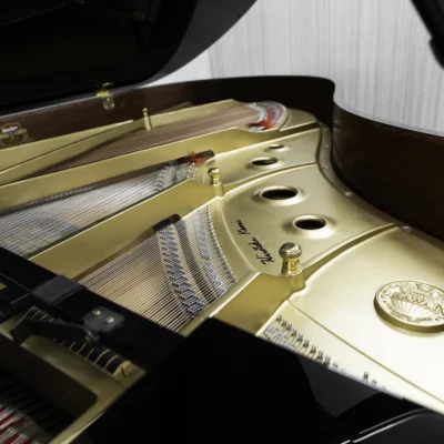 A Kawai RX-3 grand piano in a high-polish ebony finish.