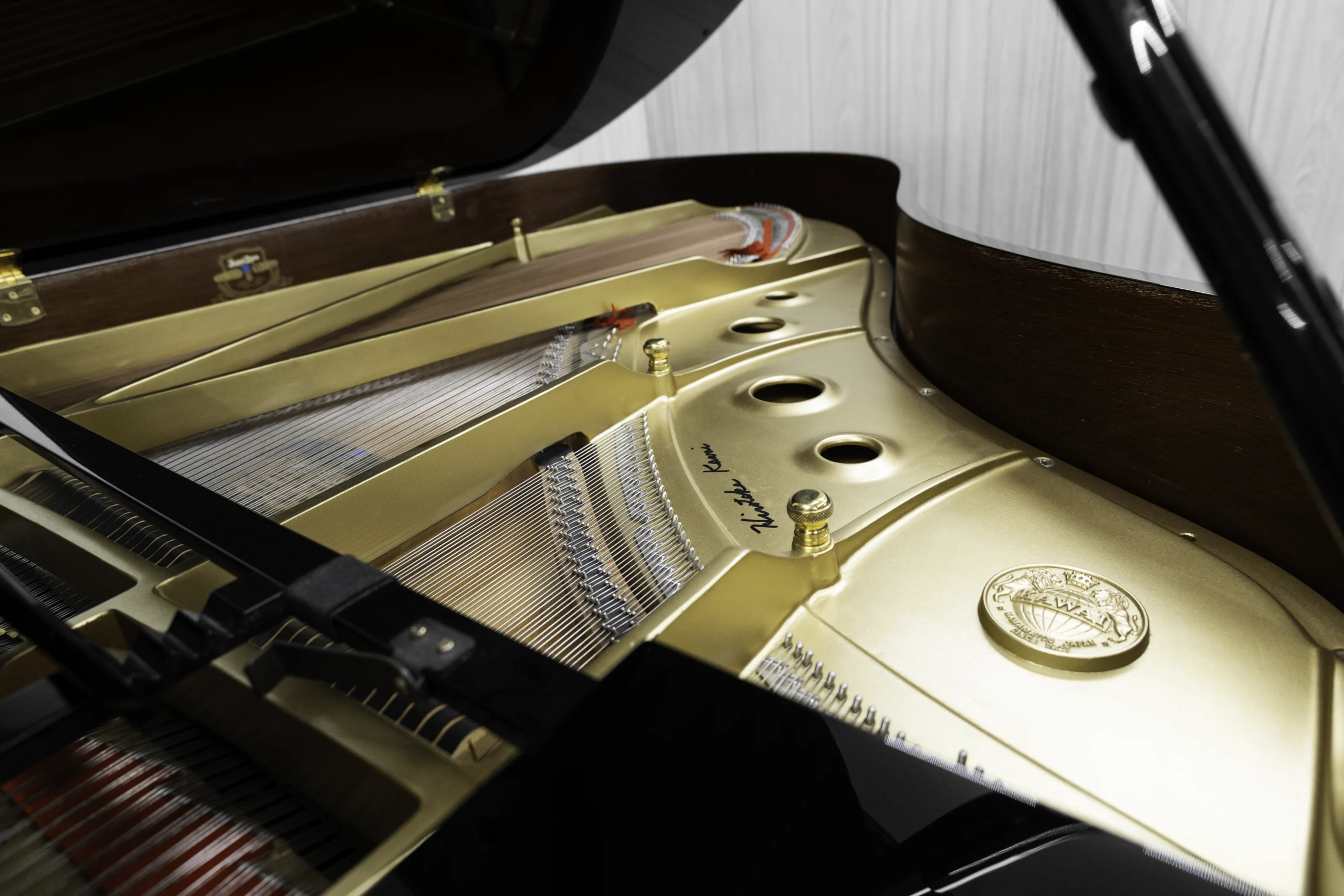A Kawai RX-3 grand piano in a high-polish ebony finish.