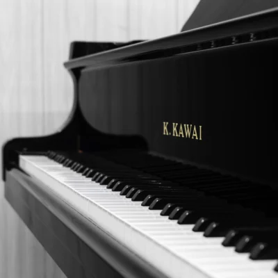 A Kawai RX-3 grand piano in a high-polish ebony finish.