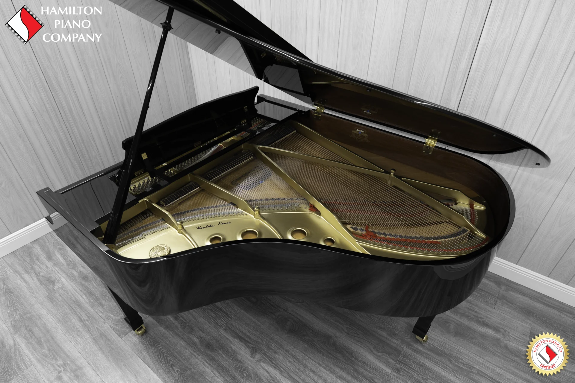 A Kawai RX-3 grand piano in a high-polish ebony finish.