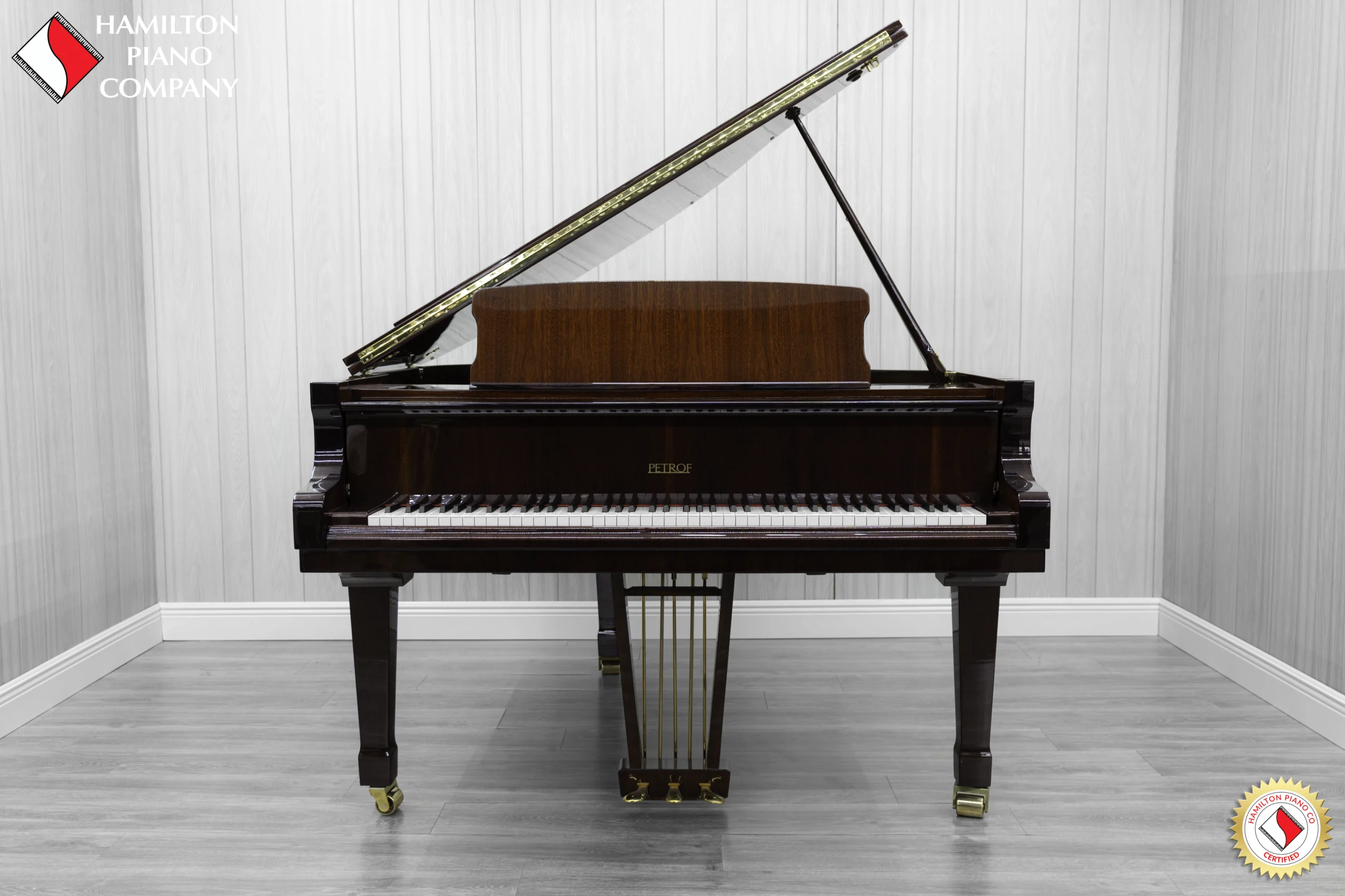 Petrof baby grand piano in high polish mahogany finish