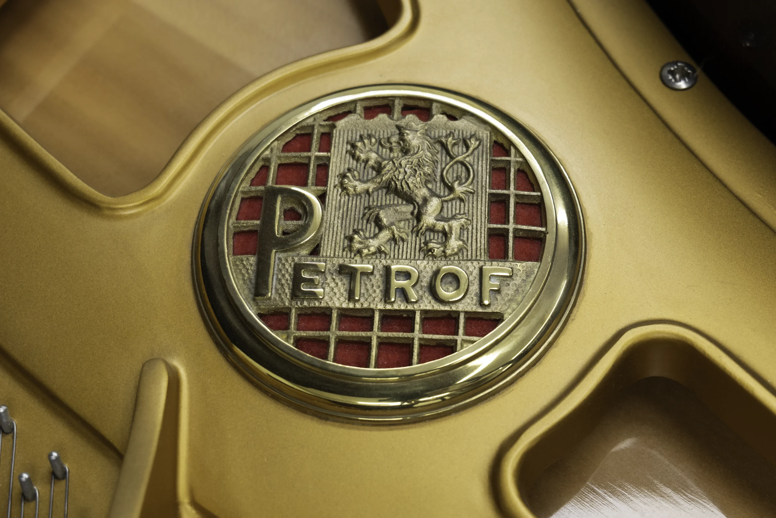 Petrof baby grand piano harp logo