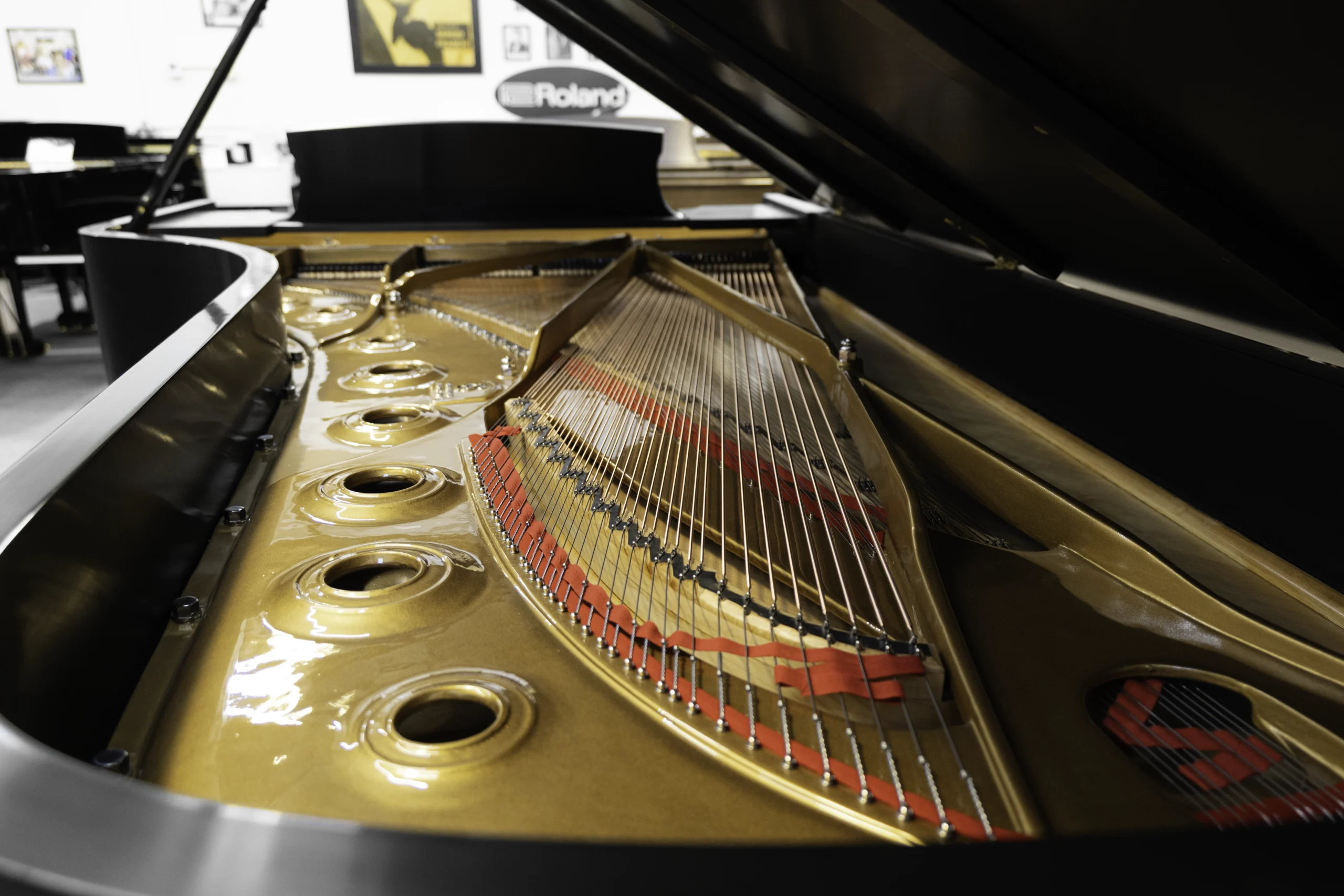 A 9ft Steinway D Concert Grand Piano in hand-rubbed satin ebony finish. An internal shot focusing on the piano harp and strings.